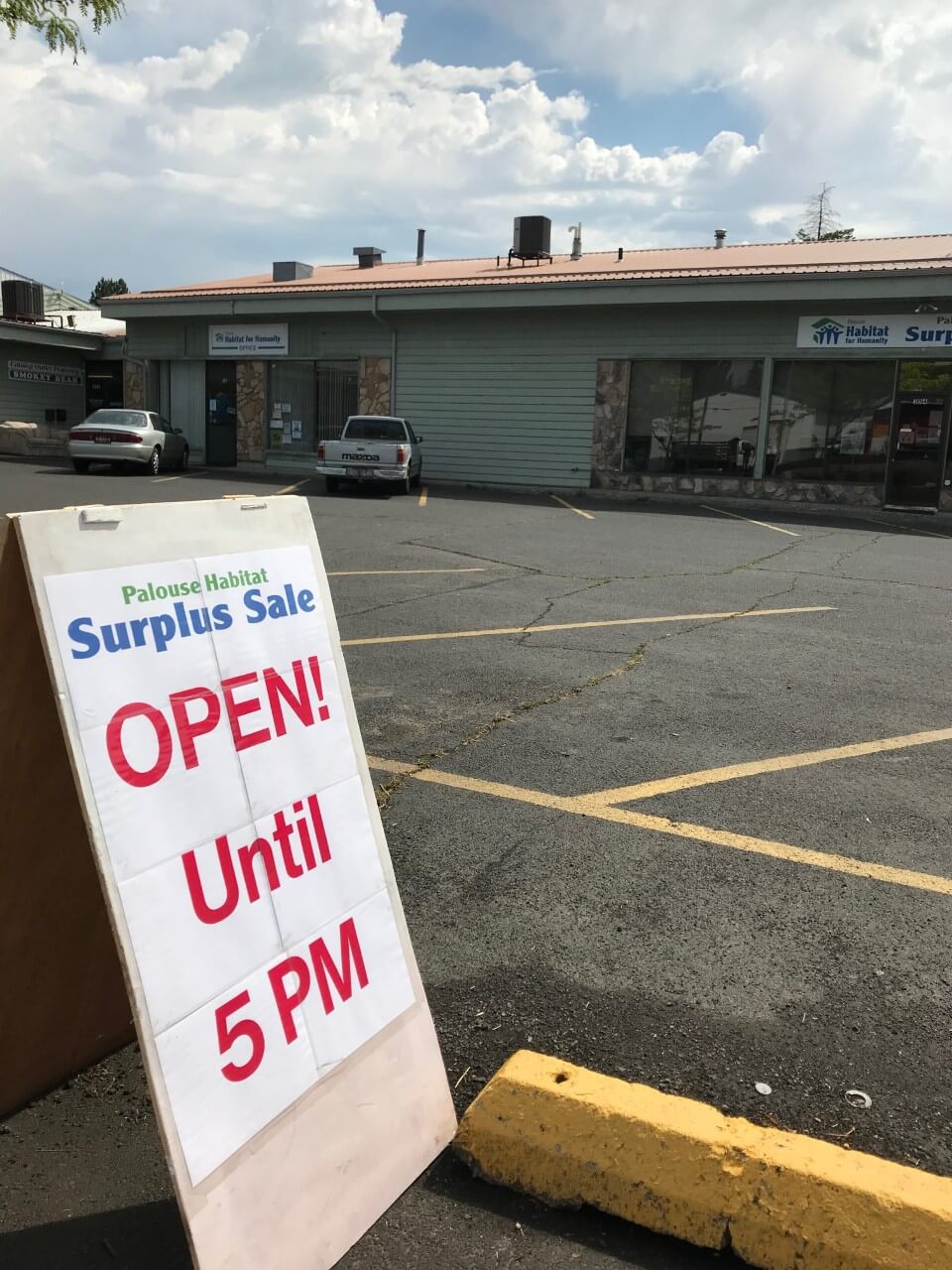 The PHFH Open Sign outside the PHFH Surplus Store.