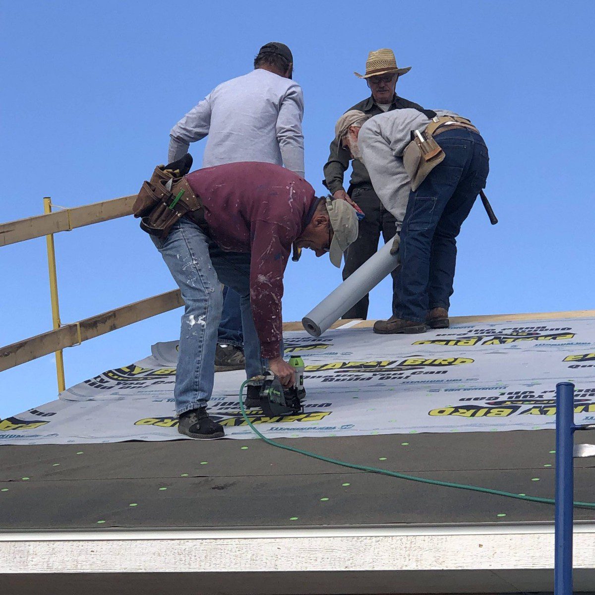 Volunteers Work on the Roof at the Build Site