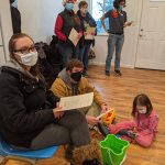 A group of PHFH volunteers listening to the Leaseburg Home Dedication Event program.