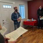 Volunteers bless the home at the Leaseburg Home Dedication Event