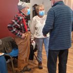 PHFH volunteers chat during the Leaseburg Home Dedication Event.