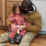 The Leaseburg family enjoying some snacks at the Leaseburg Home Dedication Event.