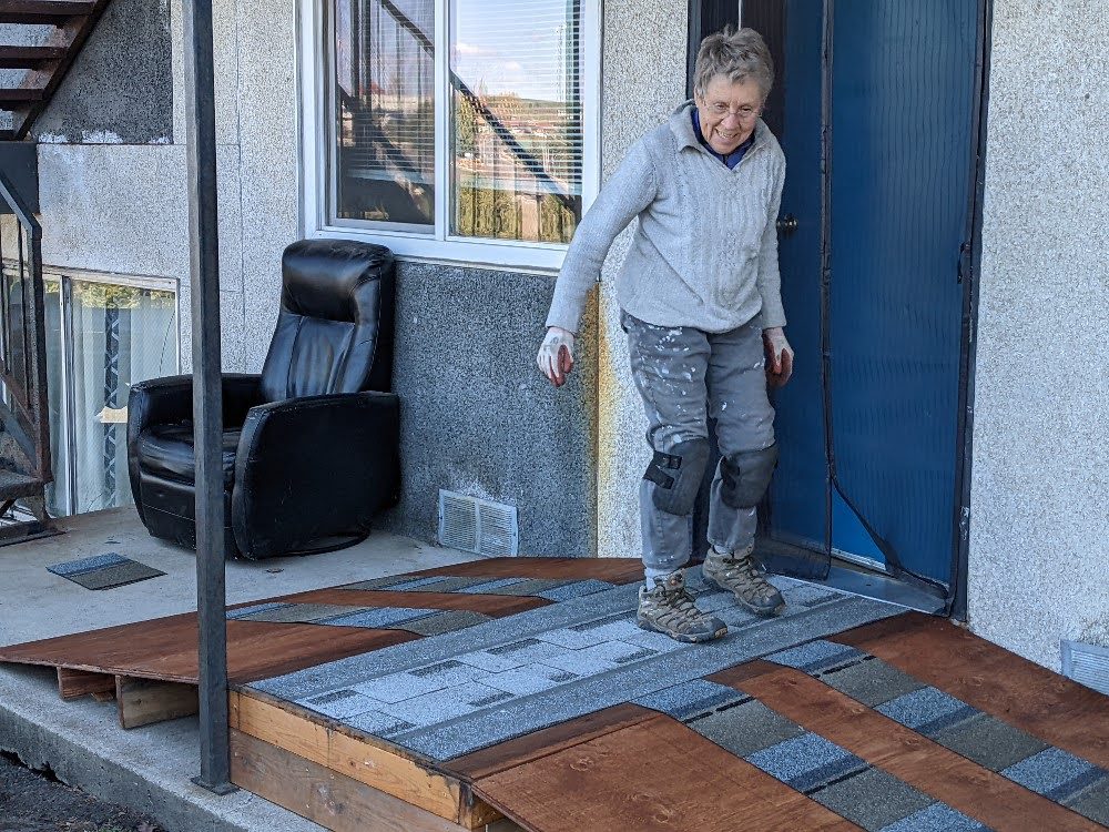 Volunteer working at the Denison Home Repair Project