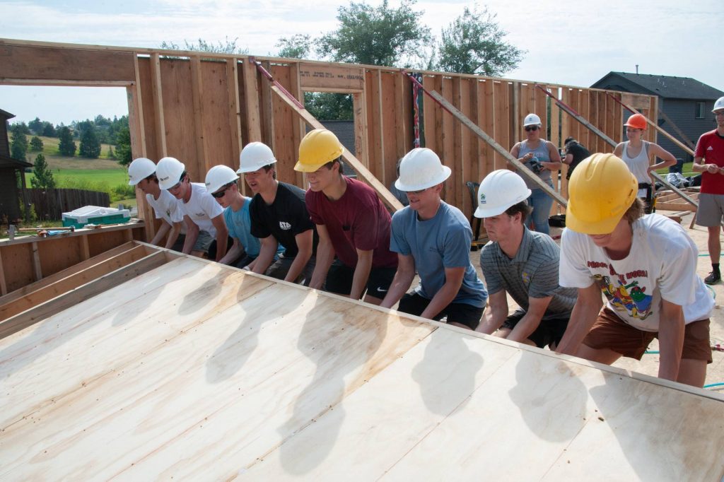 U of I Sync Volunteers Raising a Wall Section
